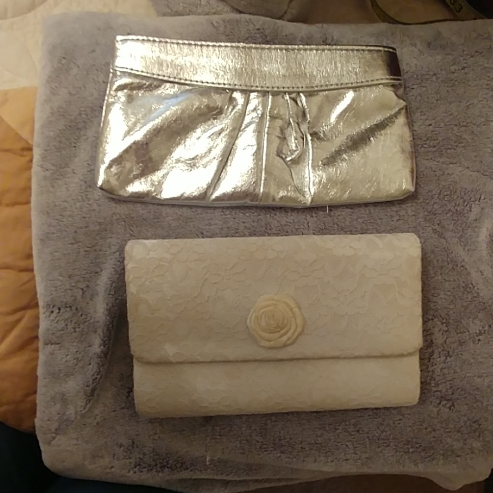 A pair of clutches one silver and one white